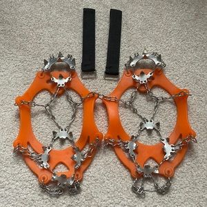 Orange crampon snow spikes